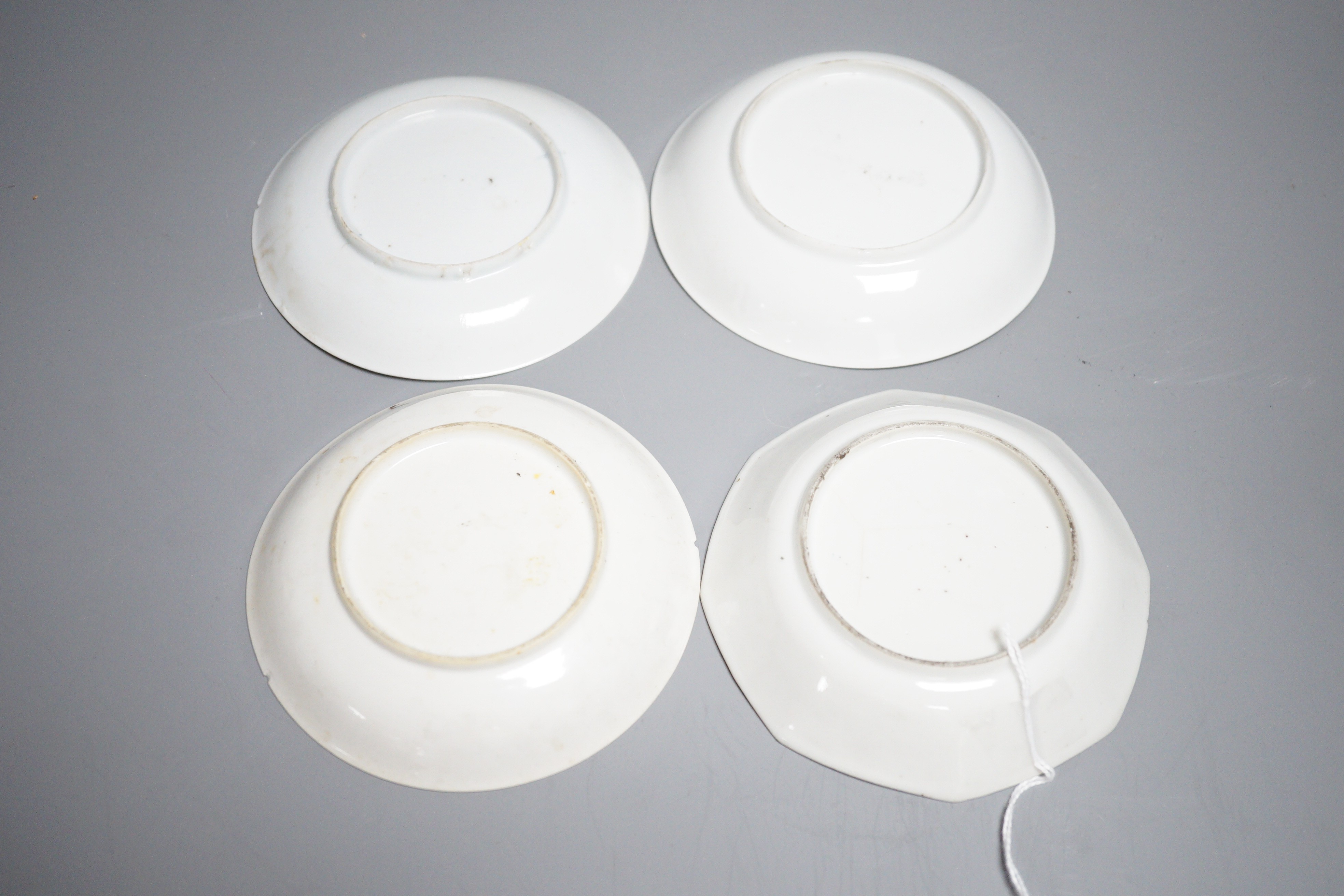A group of four 18th century Chinese export famille rose saucers